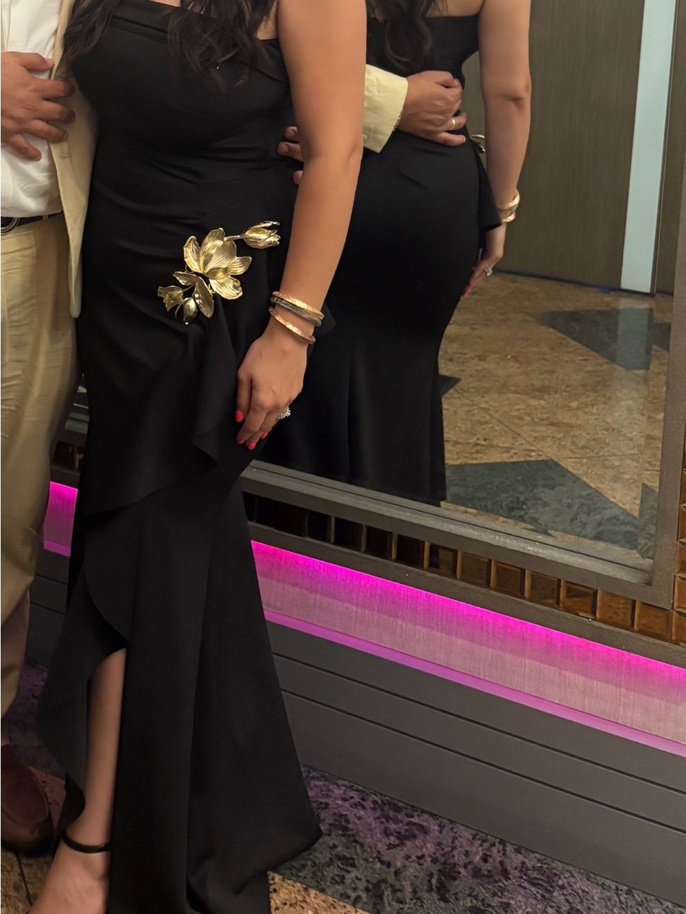 Elegant Black Evening Gown with Gold Floral Accent